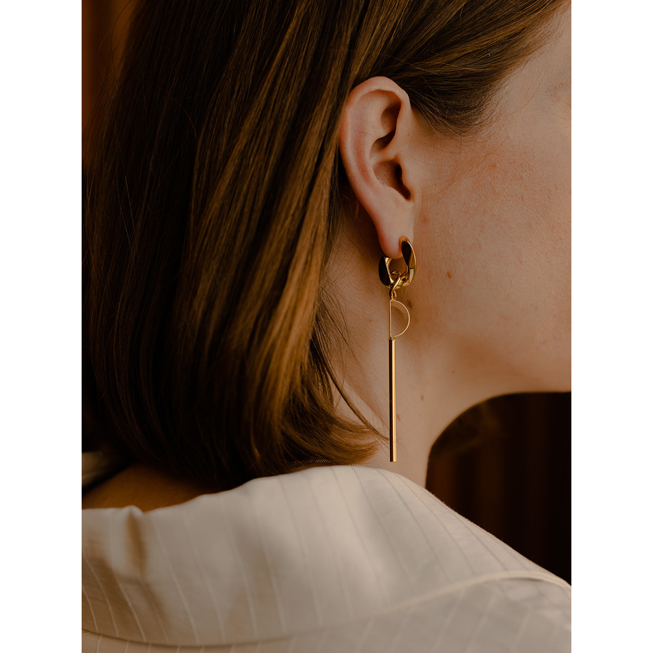 These long earrings showcase a chunky gourmet chain link hoop, evoking nostalgia from our first collection, Enchaîné, which debuted a decade ago.