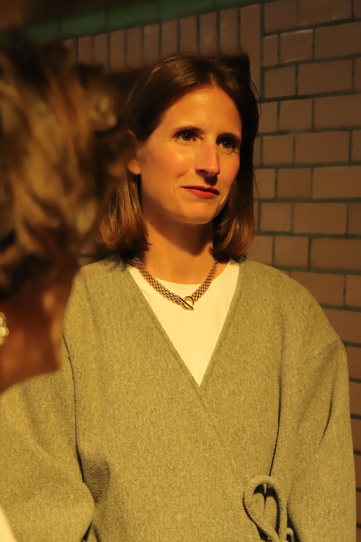 Hermien wearing Drip necklace in a portrait at La Piscine Musée Roubaix.