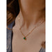 This elegant subtle necklace boasts a stunning brilliant cut green agate pendant.
