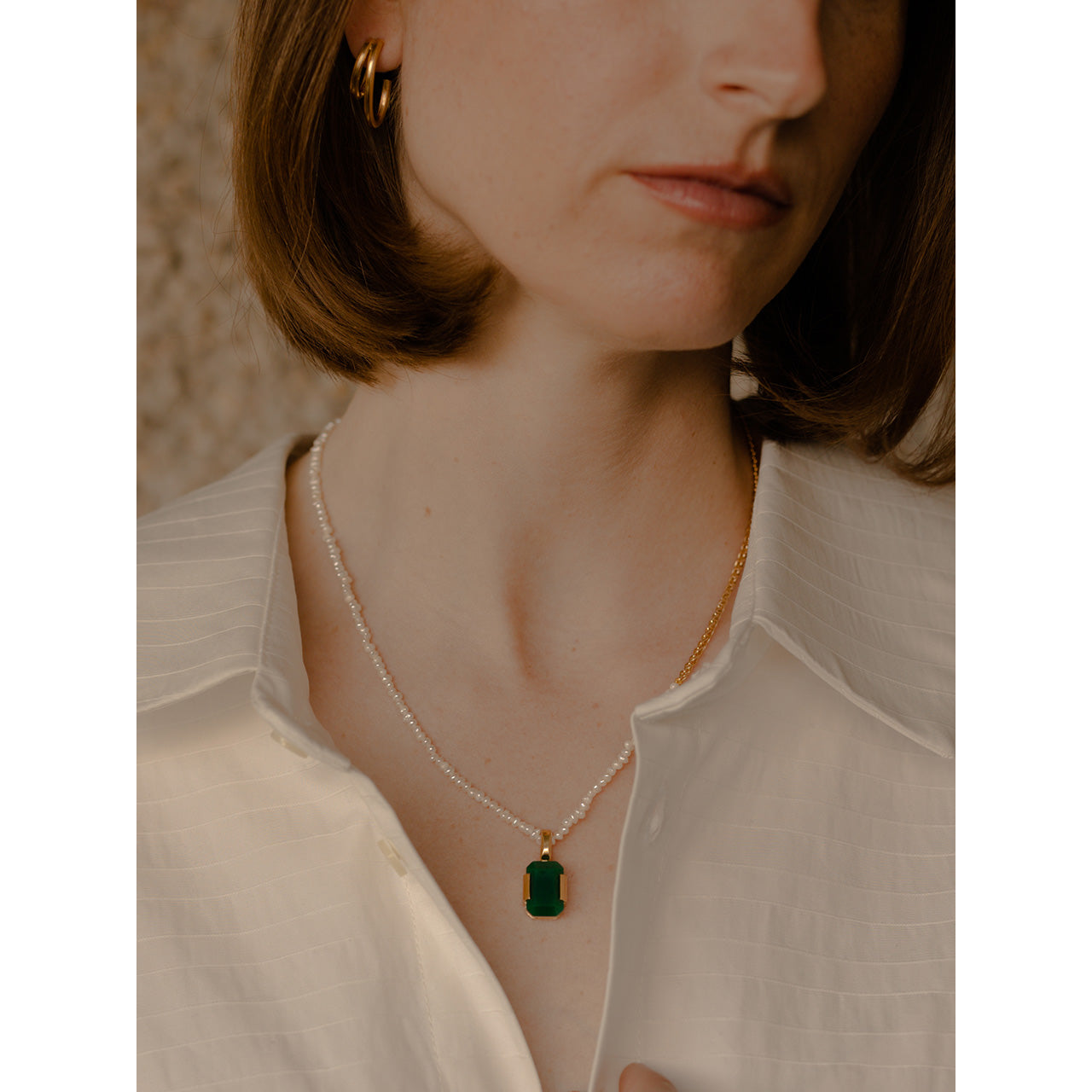 The Heritage necklace features a fusion of freshwater pearls and striking green agate.