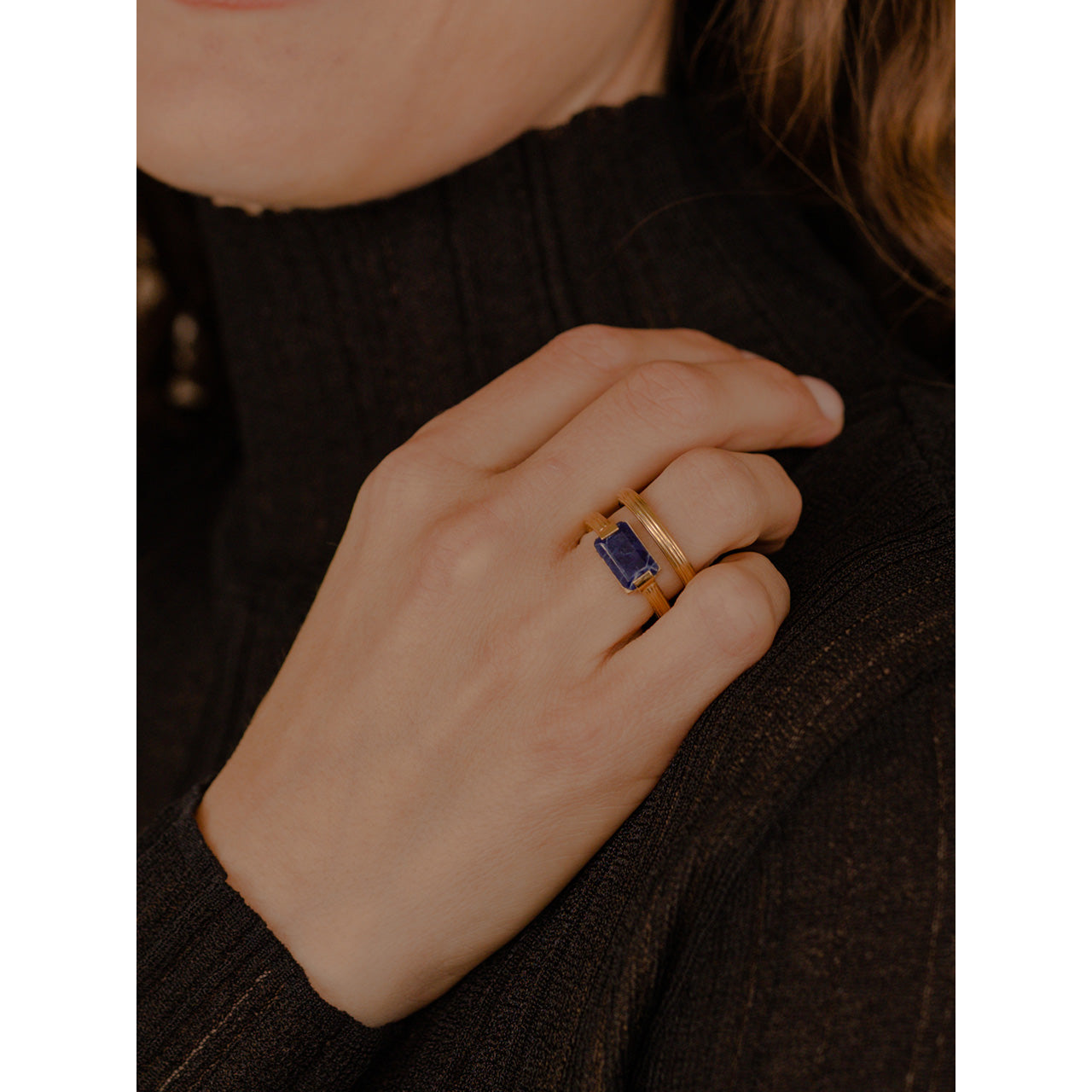 This striking statement ring with two chunky round bands, intricately engraved with a linear pattern, and a wide space elegantly separating them.