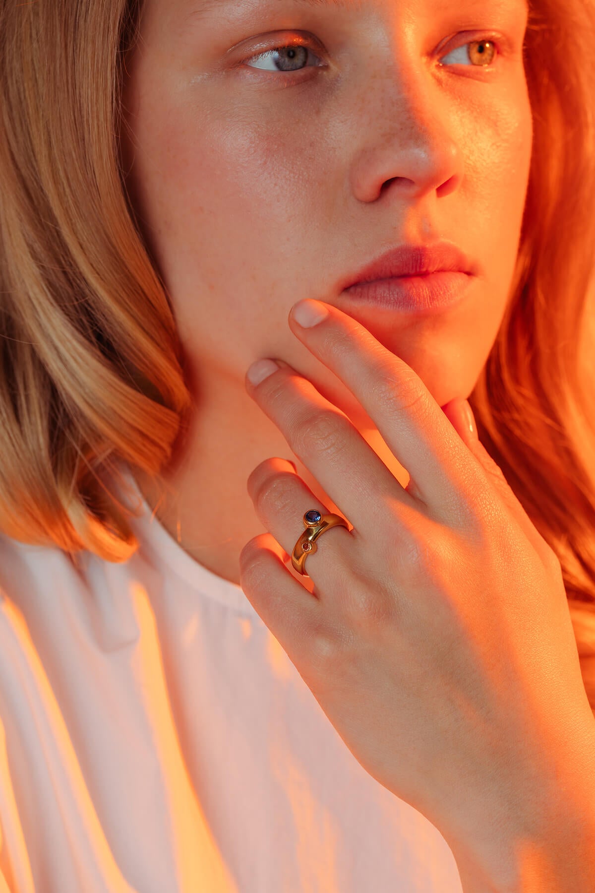 Bubble ring with cubic zirconia featuring two round cubic zirconia stones set into a rounded gold-plated band.