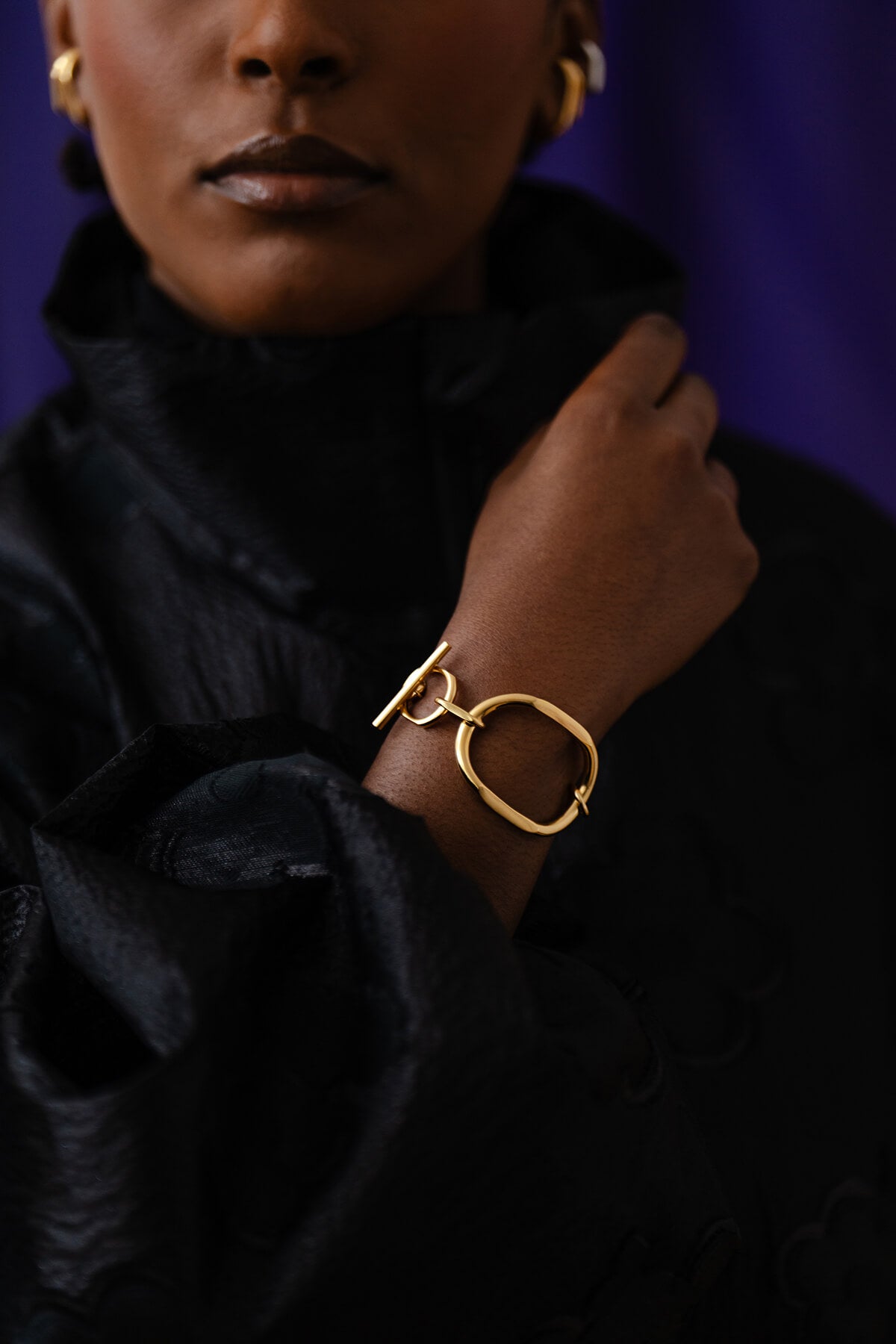 Meseret wears the Facet Bracelet, a confident design that elevates any look with bold simplicity.