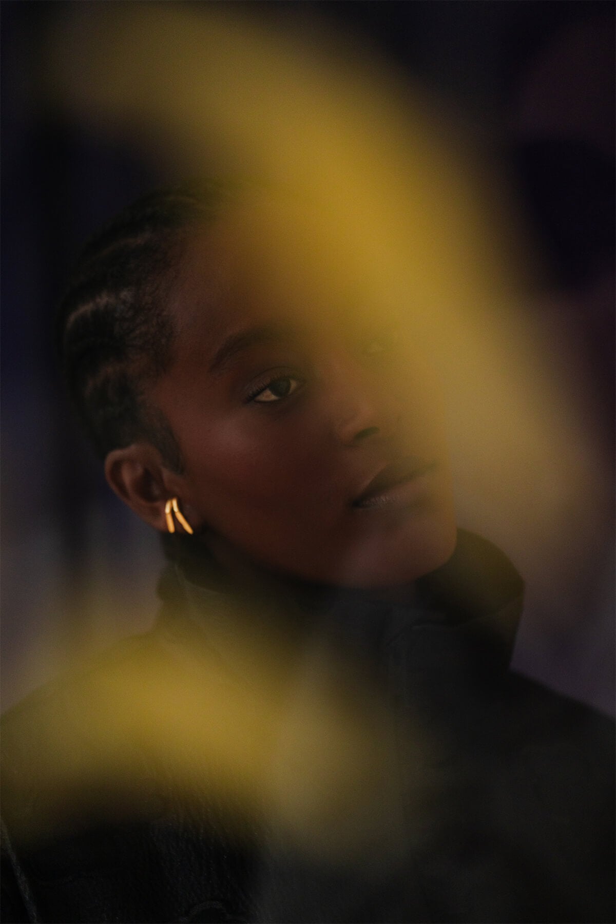 Elegant cuff-style earrings with an oval silhouette and faceted front edge, requiring only a single piercing for a bold look.