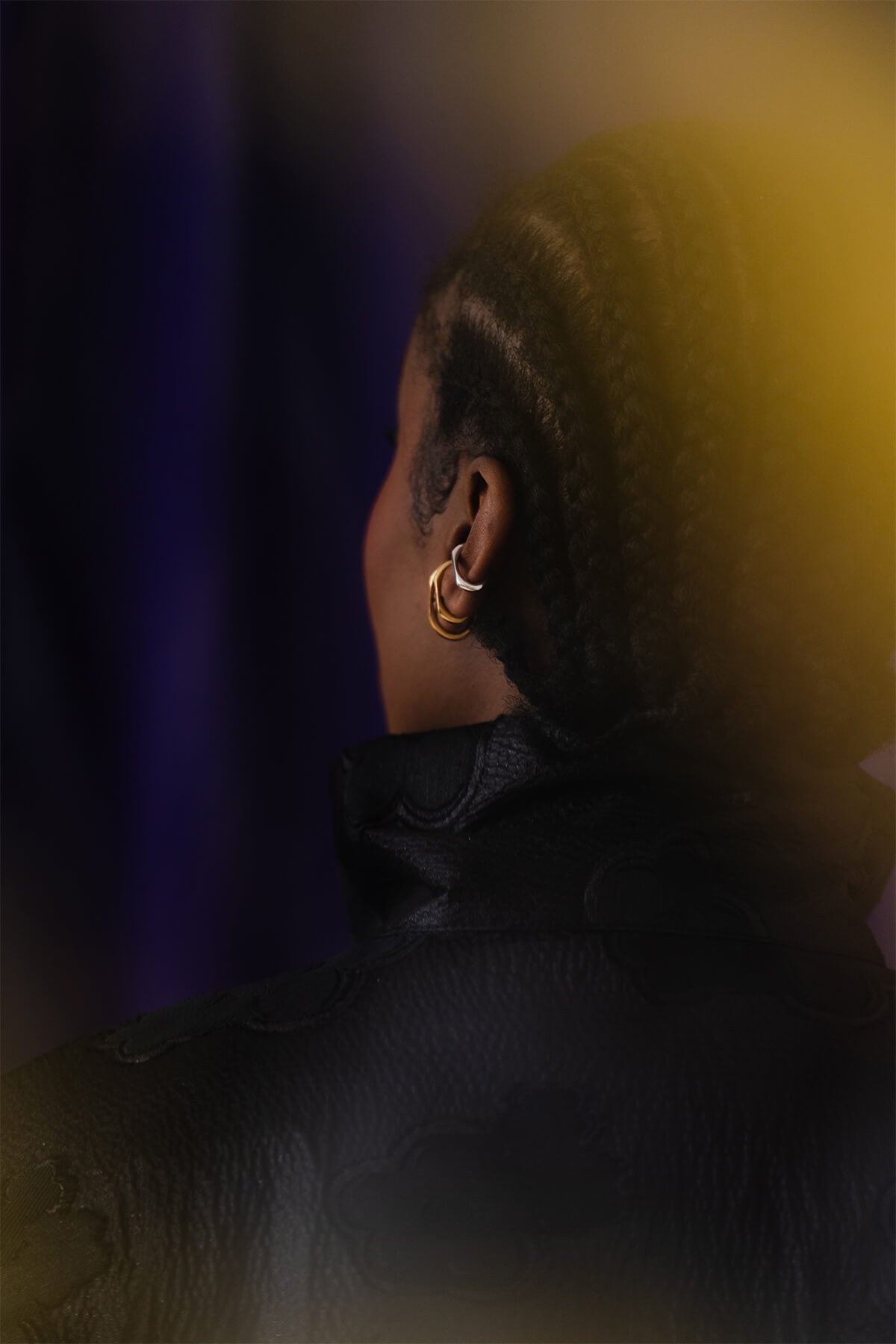 Minimalist ear cuff featuring a sculptural oval shape and a crisp facet cut, designed to hug the ear with ease.