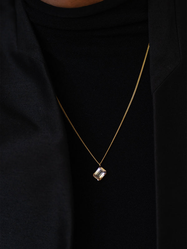 Meseret styles the Prism Necklace, highlighting its diagonal emerald-cut ametrine and refined, modern simplicity.