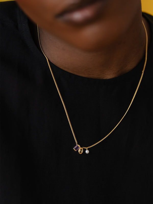 Our Ray Necklace combining amethyst, citrine, and pearl gemstones in a delicate, refined design.