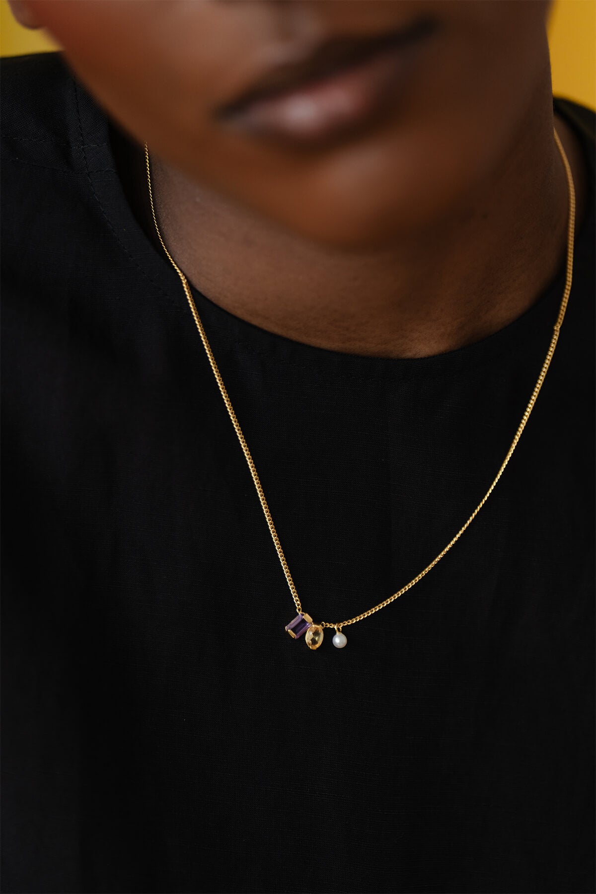 Our Ray Necklace combining amethyst, citrine, and pearl gemstones in a delicate, refined design.