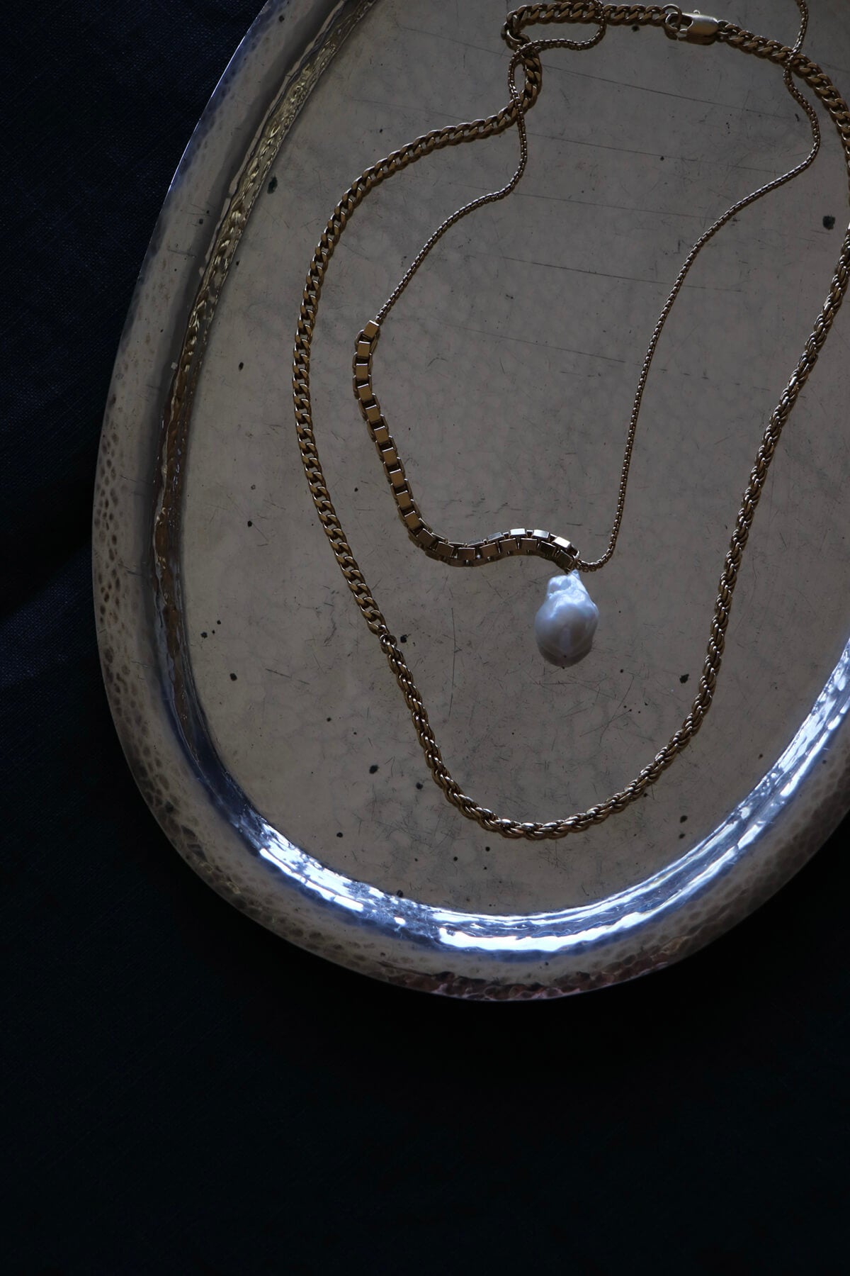 Studio Collect Carter Necklace presented on a silver tray.
