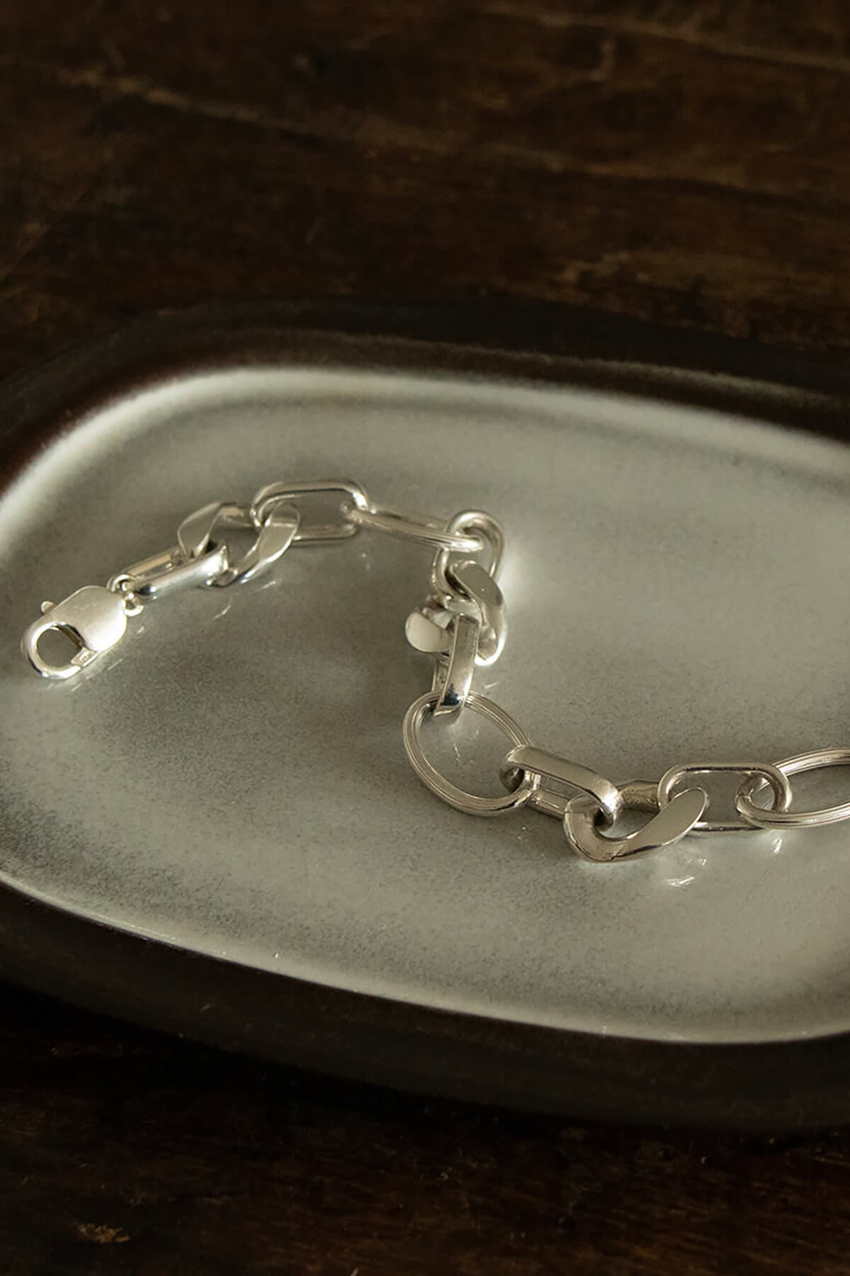 Studio Collect Carve Statement Bracelet presented on a ceramic tray.