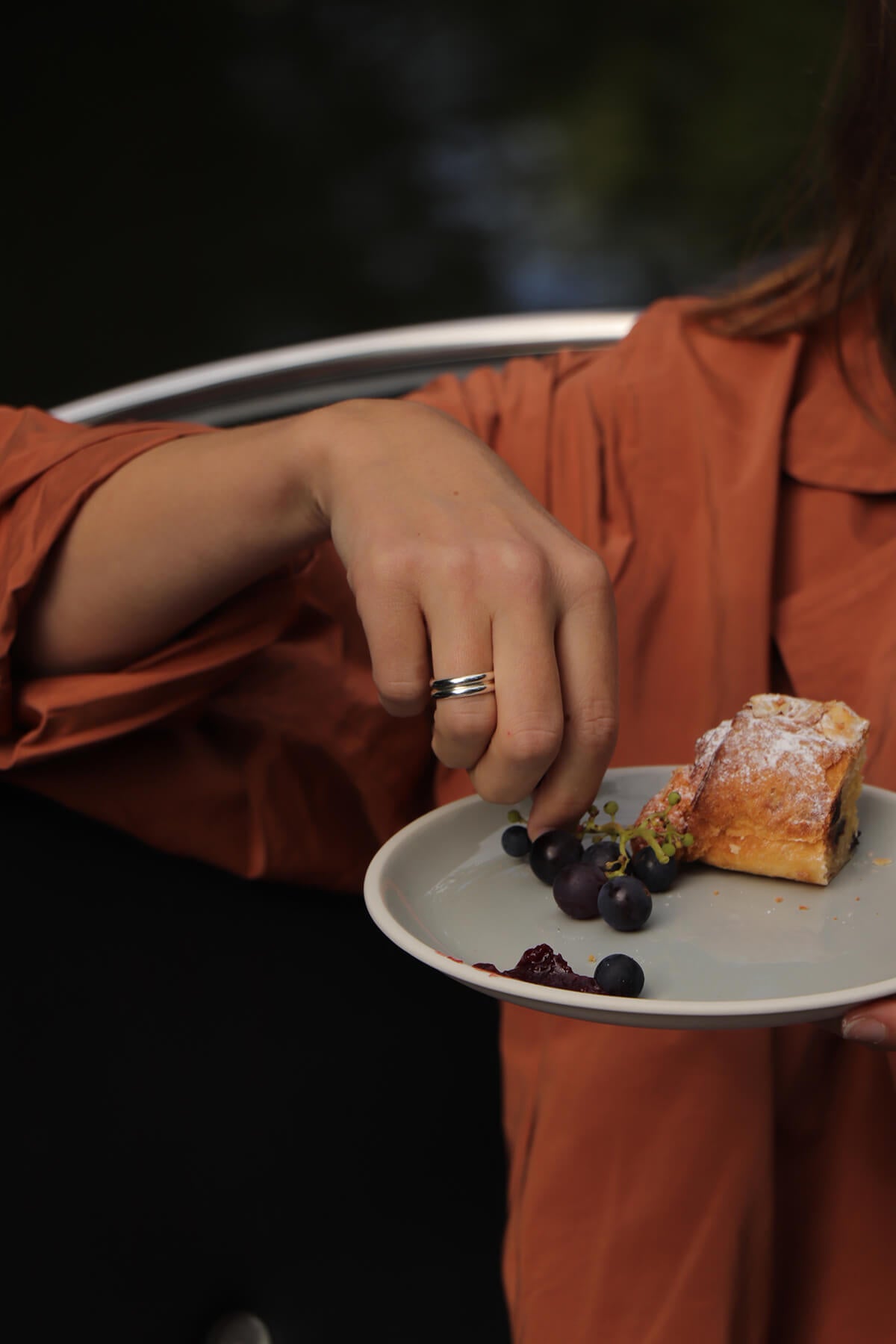 The Stack Ring that Saskia wore during a boat trip while she rested her hand on a plate of grapes and pastries.